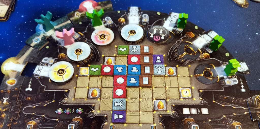 A close up of a player board with fate tiles