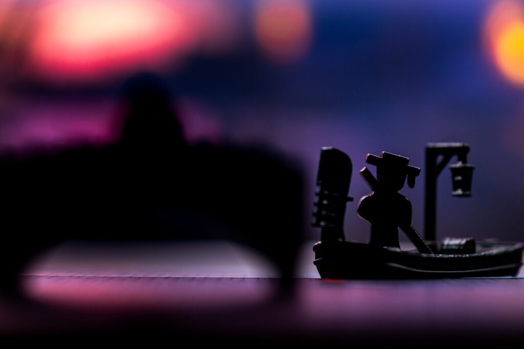 a lone gondolier at night