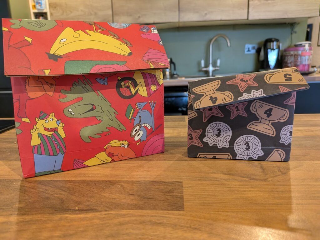 the paper bags the game pieces come in