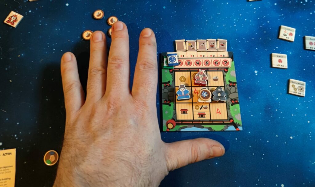 my hand next to the micro dojo board