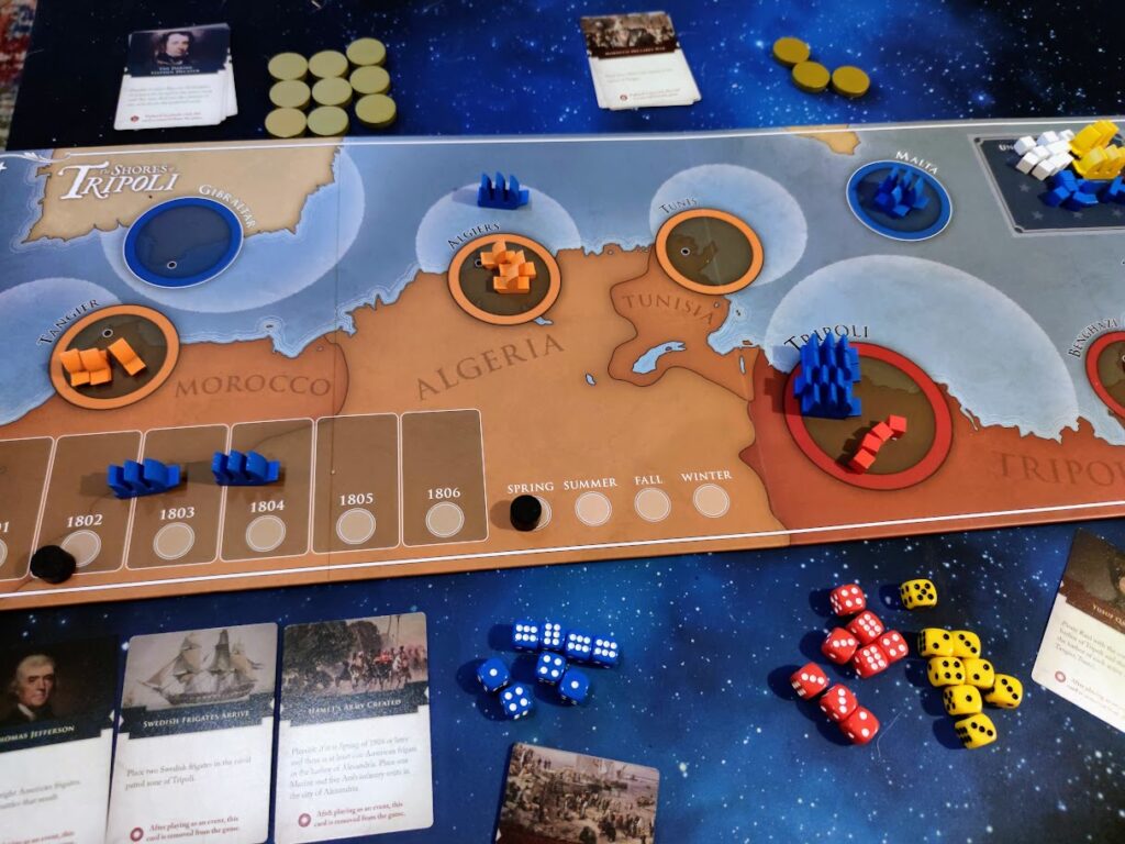 An image of the board. The board bisects the image from left to right, and the game is setup to play
