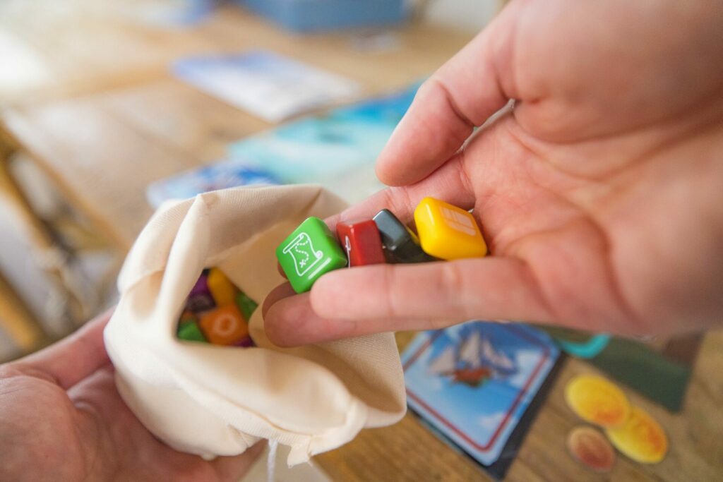 booty tiles being put into the cloth bag