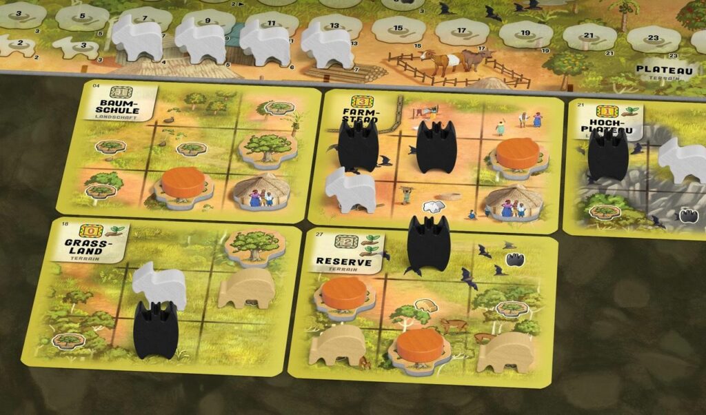 atiwa game, showing bats, fruit and goats on the player cards