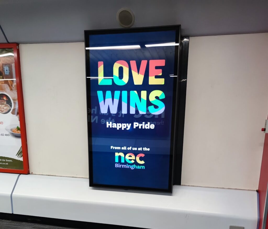 love wins pride sign at NEC
