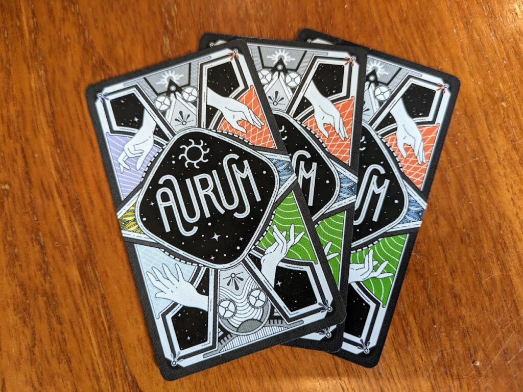 the backs of the cards in Aurum