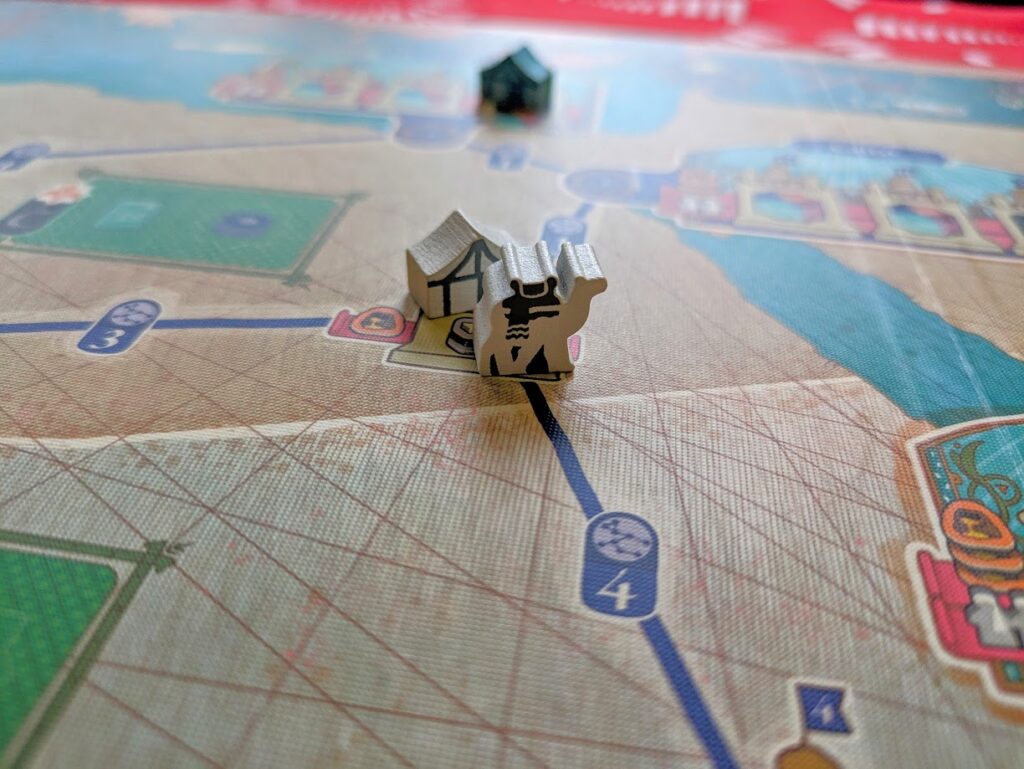 an image of a camel meeple on the game board