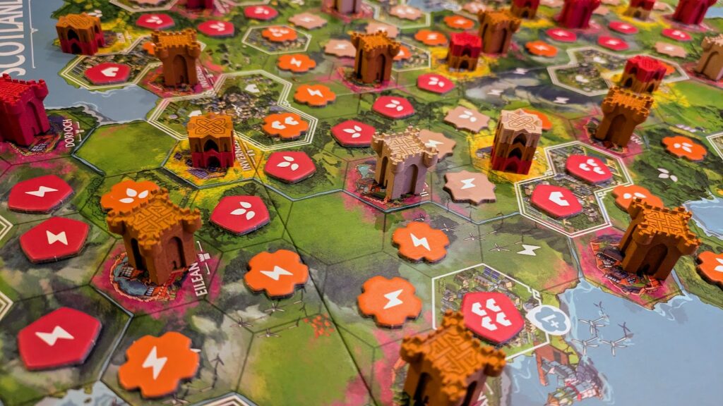 a close-up view of the tiles and castles in rebirth board game