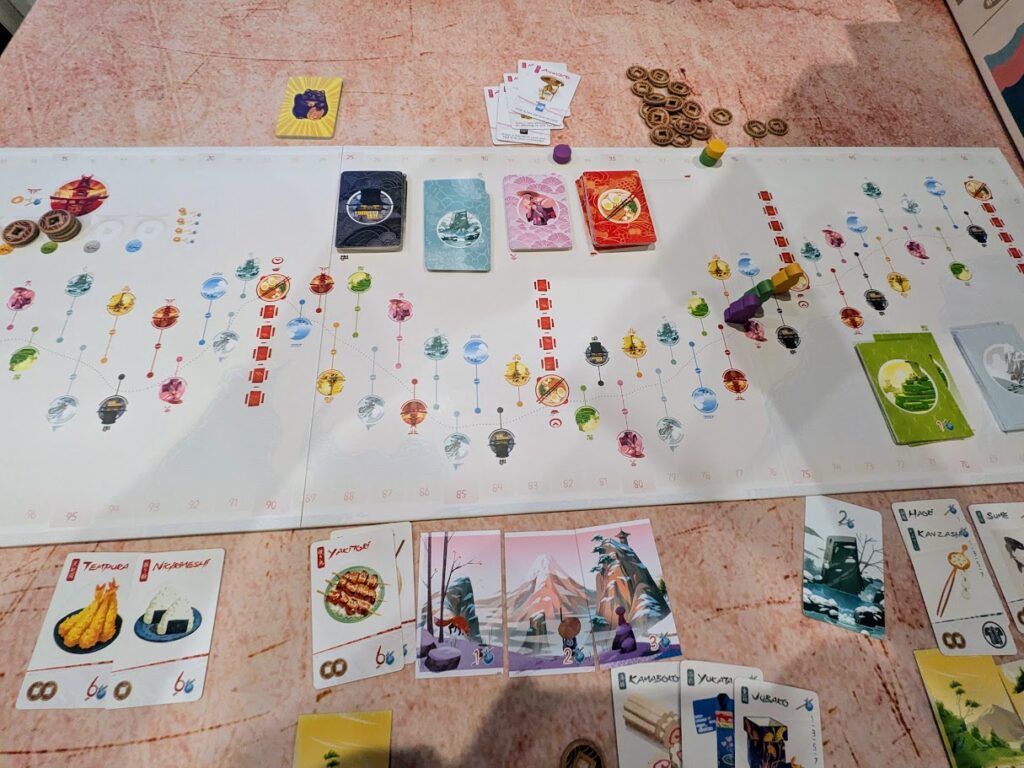an overhead view of the tokaido board game