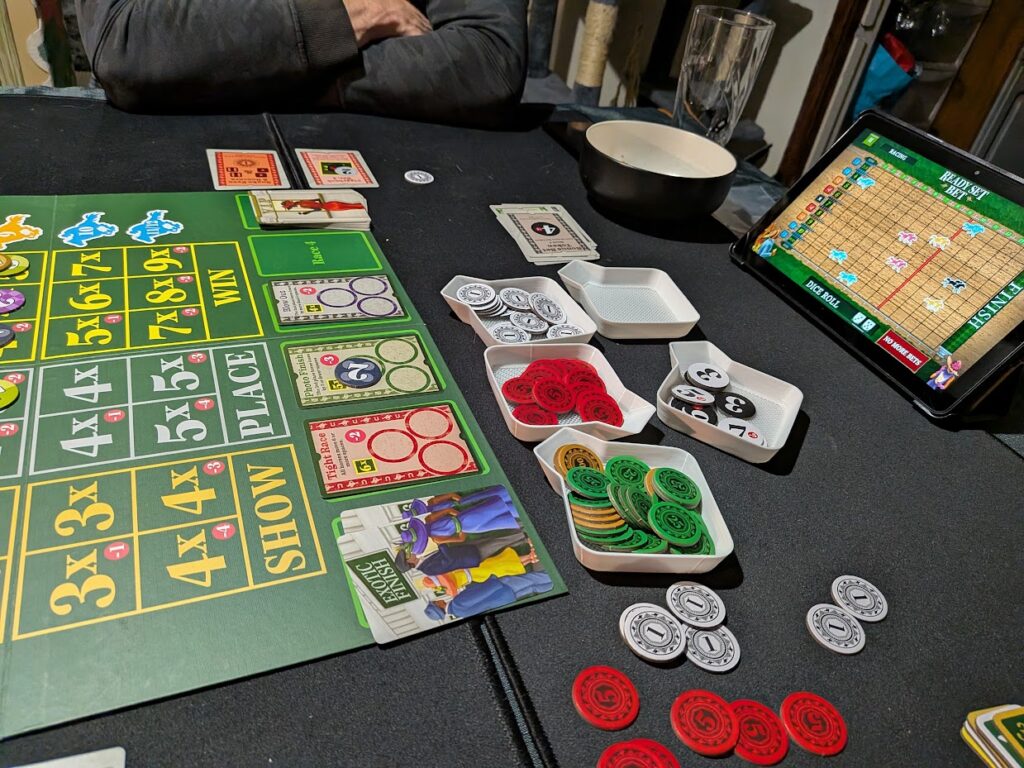 the app running on a tablet at the end of the table