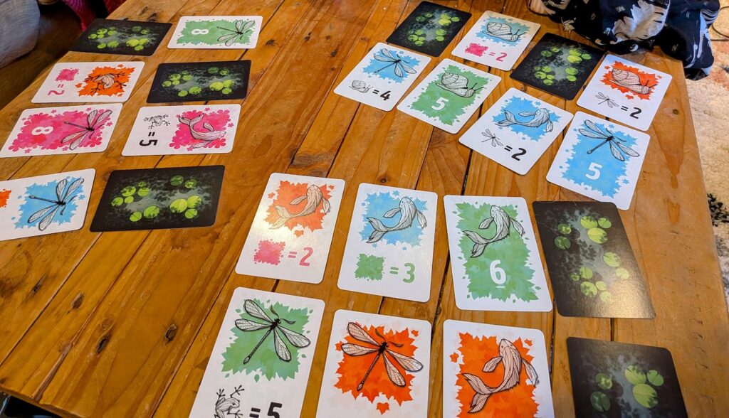 A two player game of symbiosis in action on a coffee table