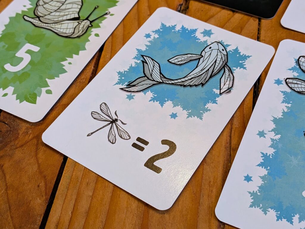 a close up of a blue fish card