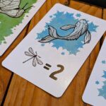 a close up of a blue fish card